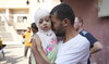 A Palestinian man reacts as he says goodbye to his sick daughter before leaving the Gaza Strip to get treatment abroad.