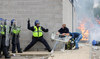 A police officer clashes with a protestor outside a hotel in Rotherham, Britain, August 4, 2024. (Reuters)