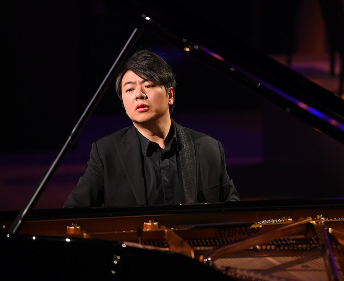 Chinese pianist Lang Lang performs music during the shooting of