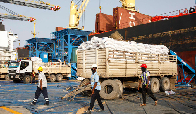 Grain from US Aid is unloaded from a ship and bagged at Berbera Port in Somaliland. (AFP file photo)