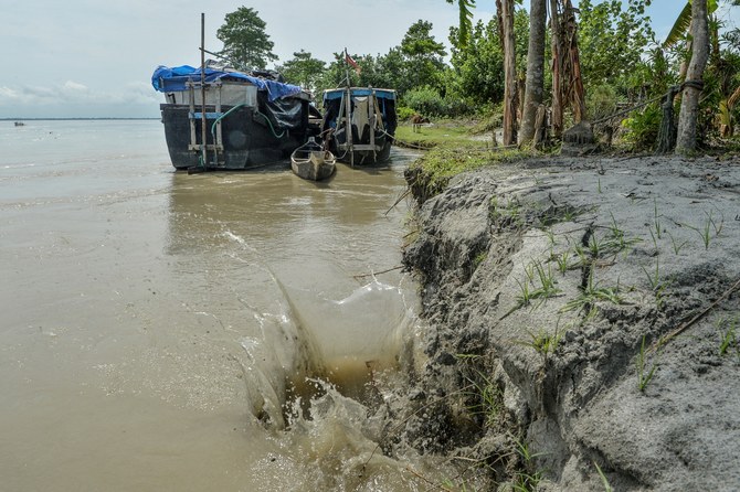 Rising seawater levels are leading to soil erosion, as well as to much higher soil salinity, rendering it infertile (File/AFP)