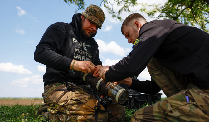 Ukrainian servicemen prepare an FPV drone for a test flight at a training ground in Donetsk region. (REUTERS)