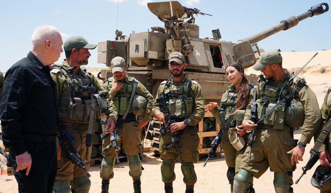 Israeli Defence Minister Yoav Gallant standing with soldiers in southern Israel near Rafah. (AFP)